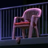 A plastic garden chair on a balcony